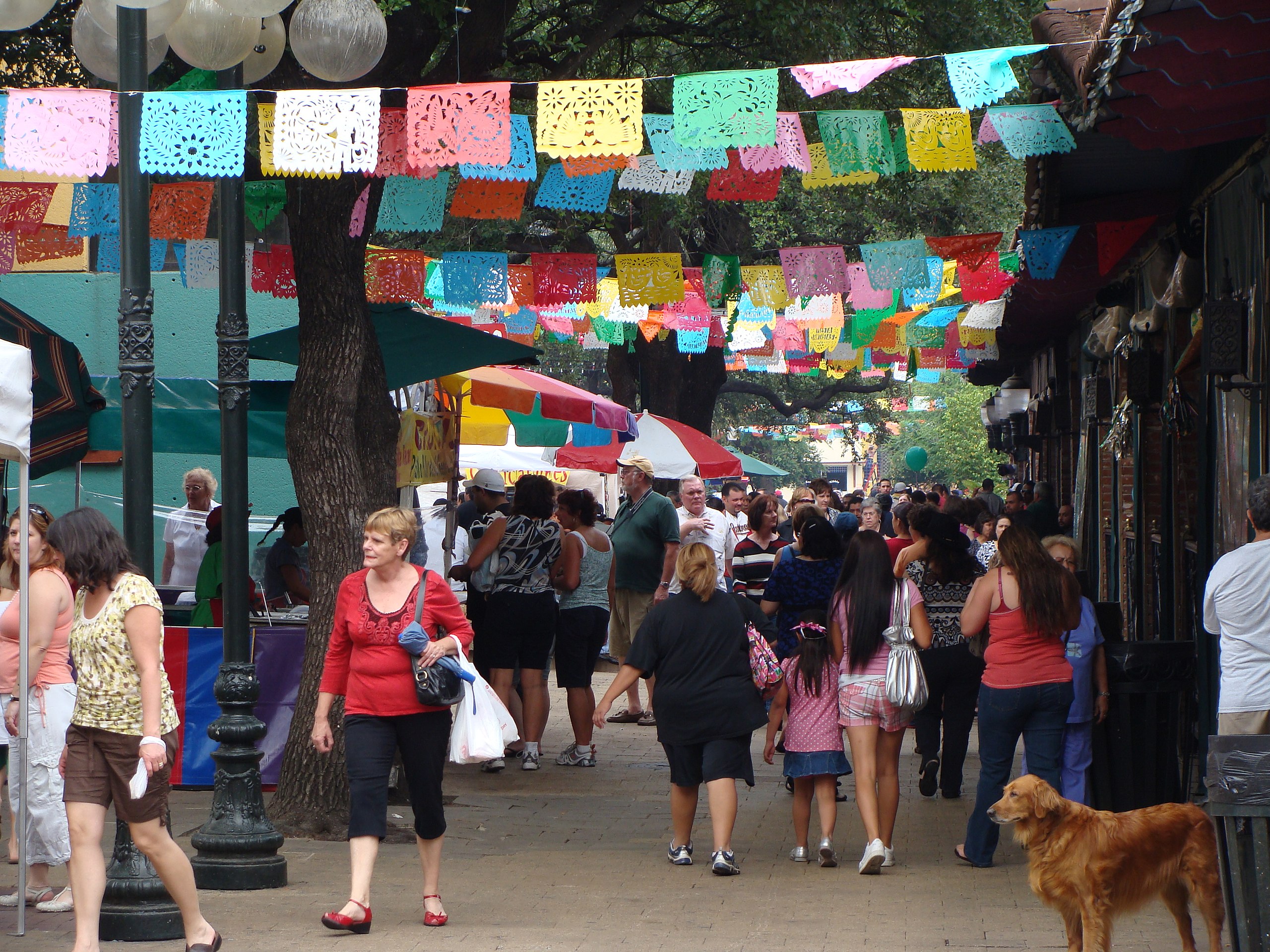 Here is a picture of the San Antonio Market Square. There are lots of people walking around, seeming to have a fun time. Above them are colorful papel picado hanging around, remnant of the strong Mexican influence of the city and the marketsquare itself.