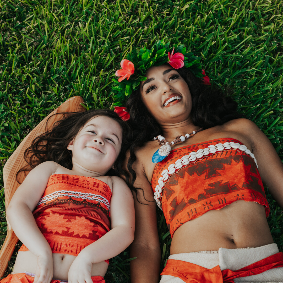a little girl and a teenage girl are dressed up as Moana characters from Once Upon a Party!